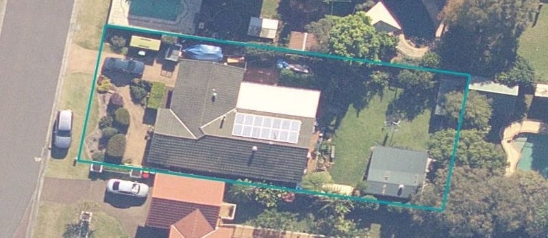 A property review showing a satellite image with the property boundary outlined in teal